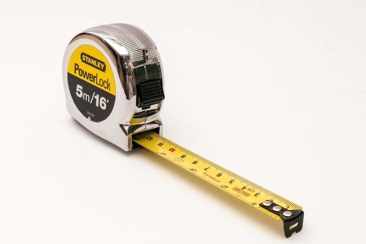 Close-up of a tape measure extended on a work surface