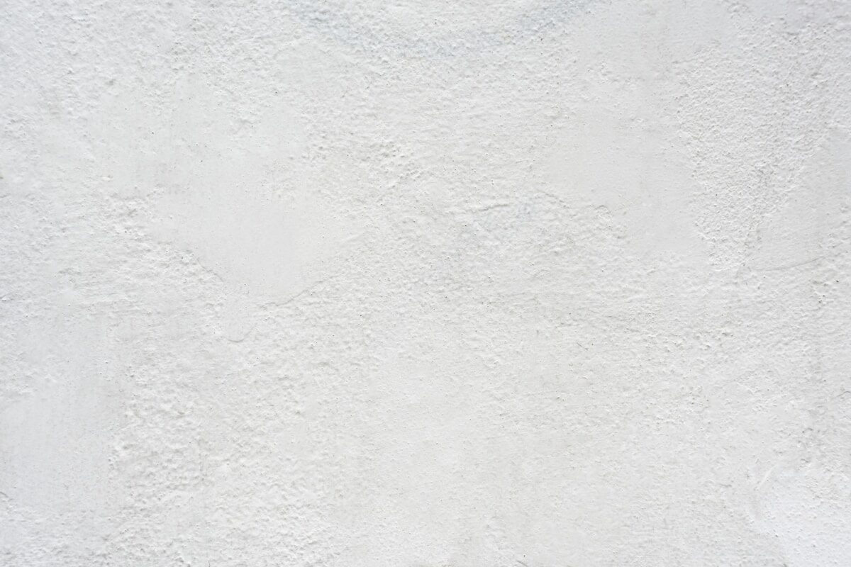 A smooth white plastered wall surface with a fine texture